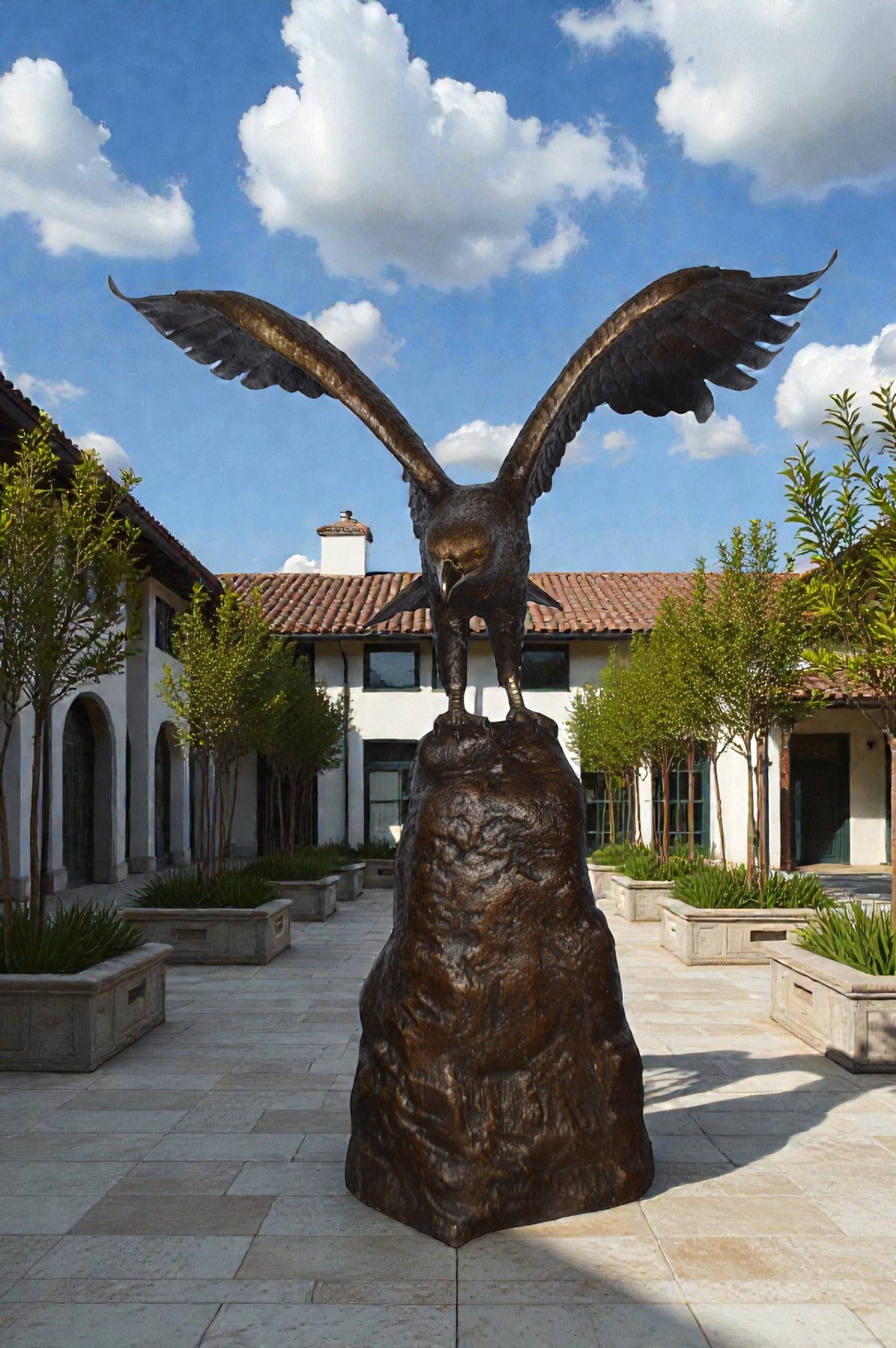 Eagle Landing on a Rock Bronze Statue - Size: 51"L x 36"W x 58"H.