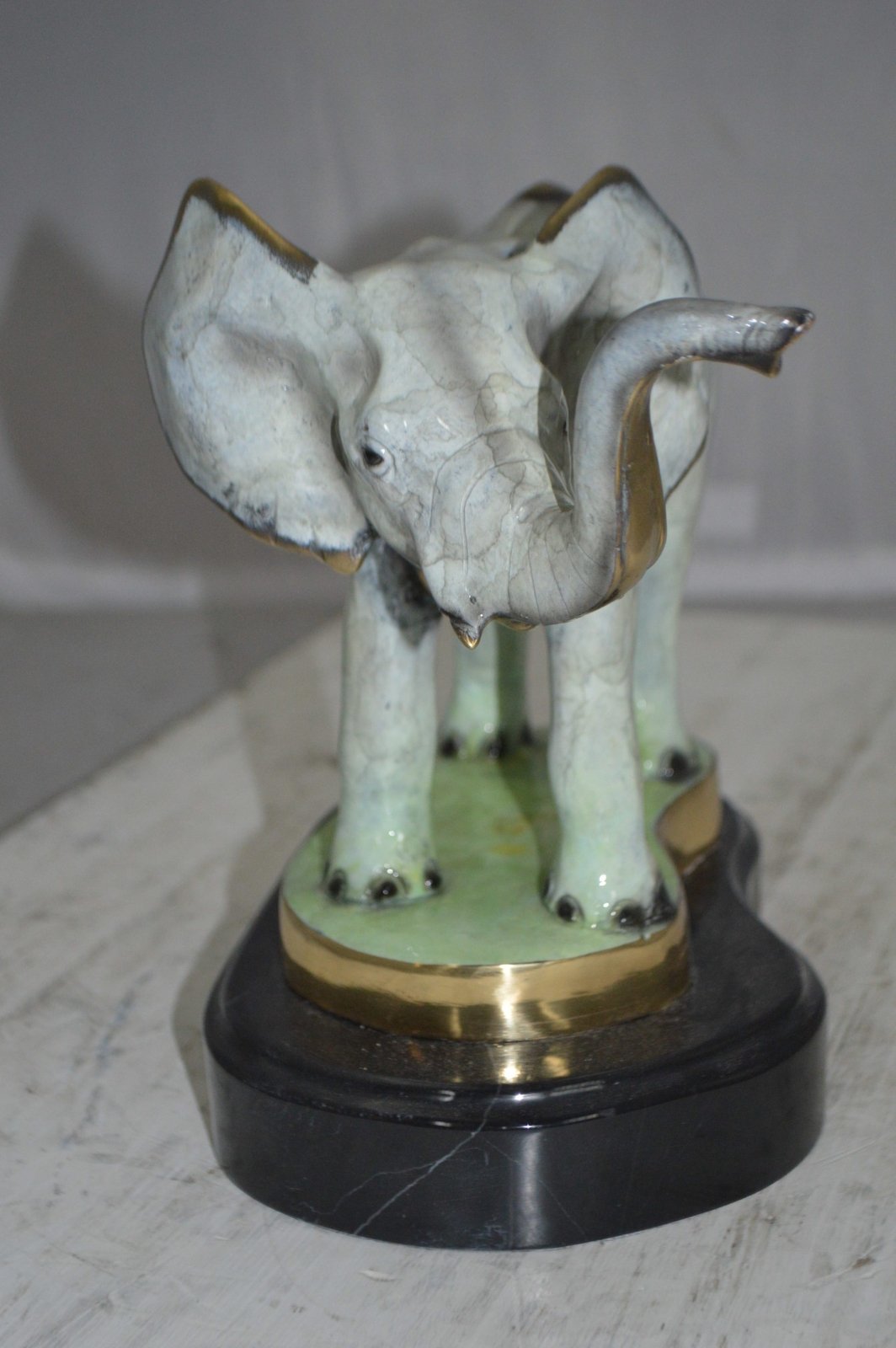 Elephant trunk Up Bronze Statue -  Size: 16"L x 9"W x 10"H.
