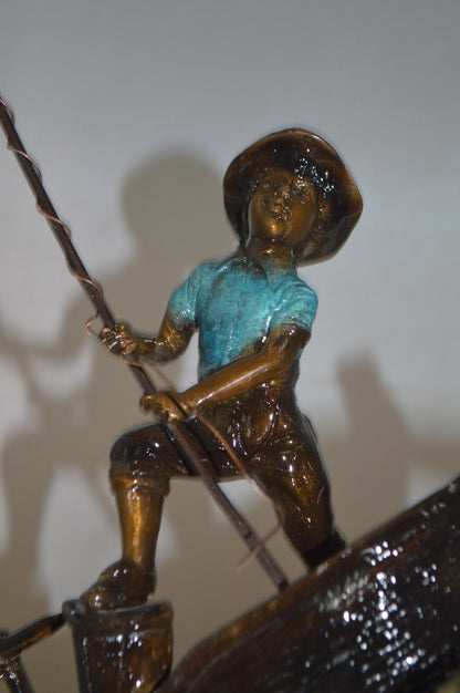 Old Man Fishing a Large Catch Bronze Statue -  Size: 27"L x 13"W x 30"H.