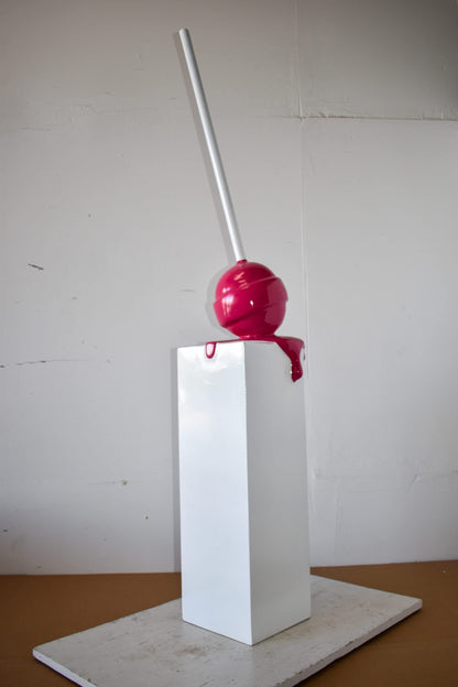 Red Lollipop Mounted on A White Pedestal Resin Statue Size: 10" x 10" x 59"H