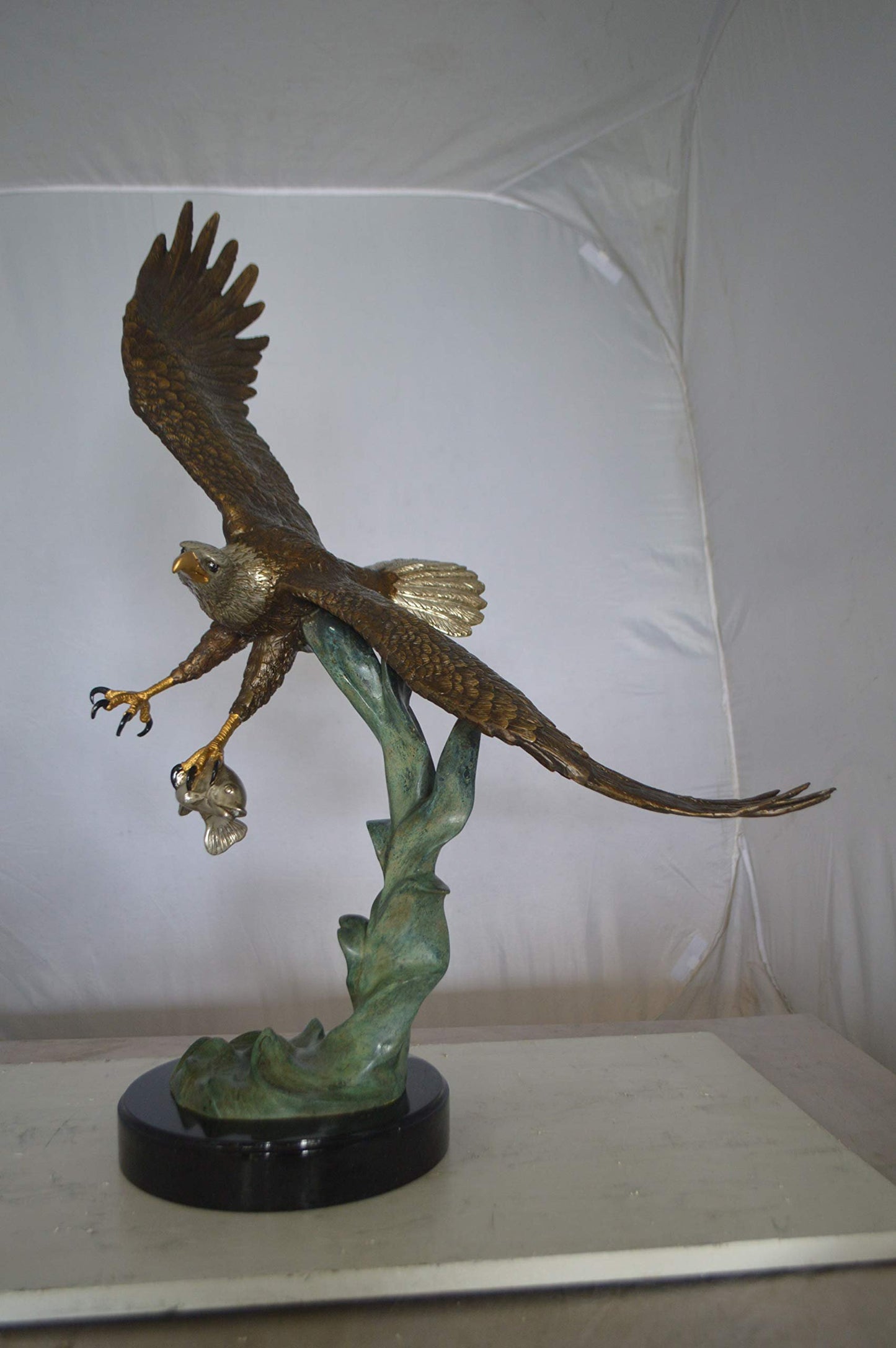 Eagle Flying With His Pray Bronze Statue -  Size: 32"L x 15"W x 33"H.