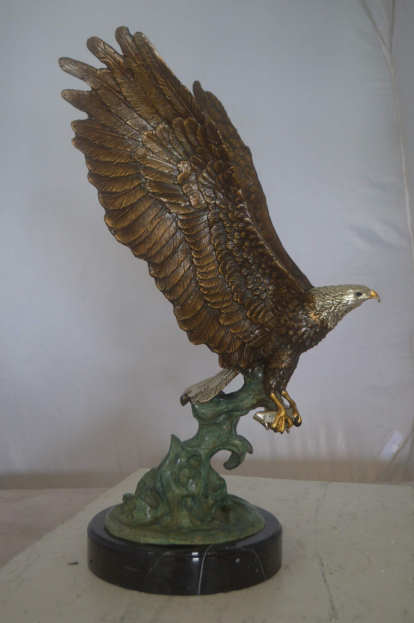 Eagle Catching His Prey from Water Bronze Statue -  Size: 14"L x 13"W x 26"H.