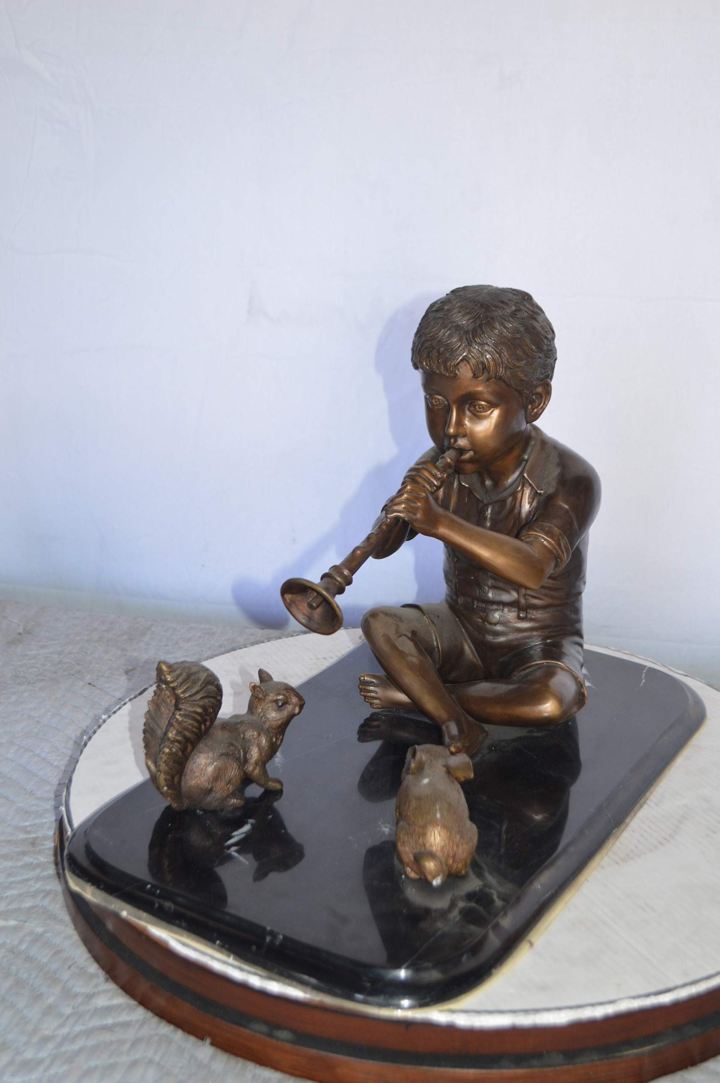 Boy With Rabbit And Squirrel Bronze Statue -  Size: 22"L x 13"W x 16"H.