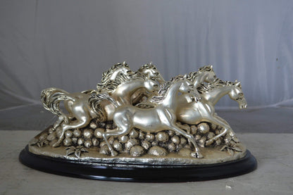 Charging horses resin statue on wood base - Size: 17"L x 10"W x 5"H.