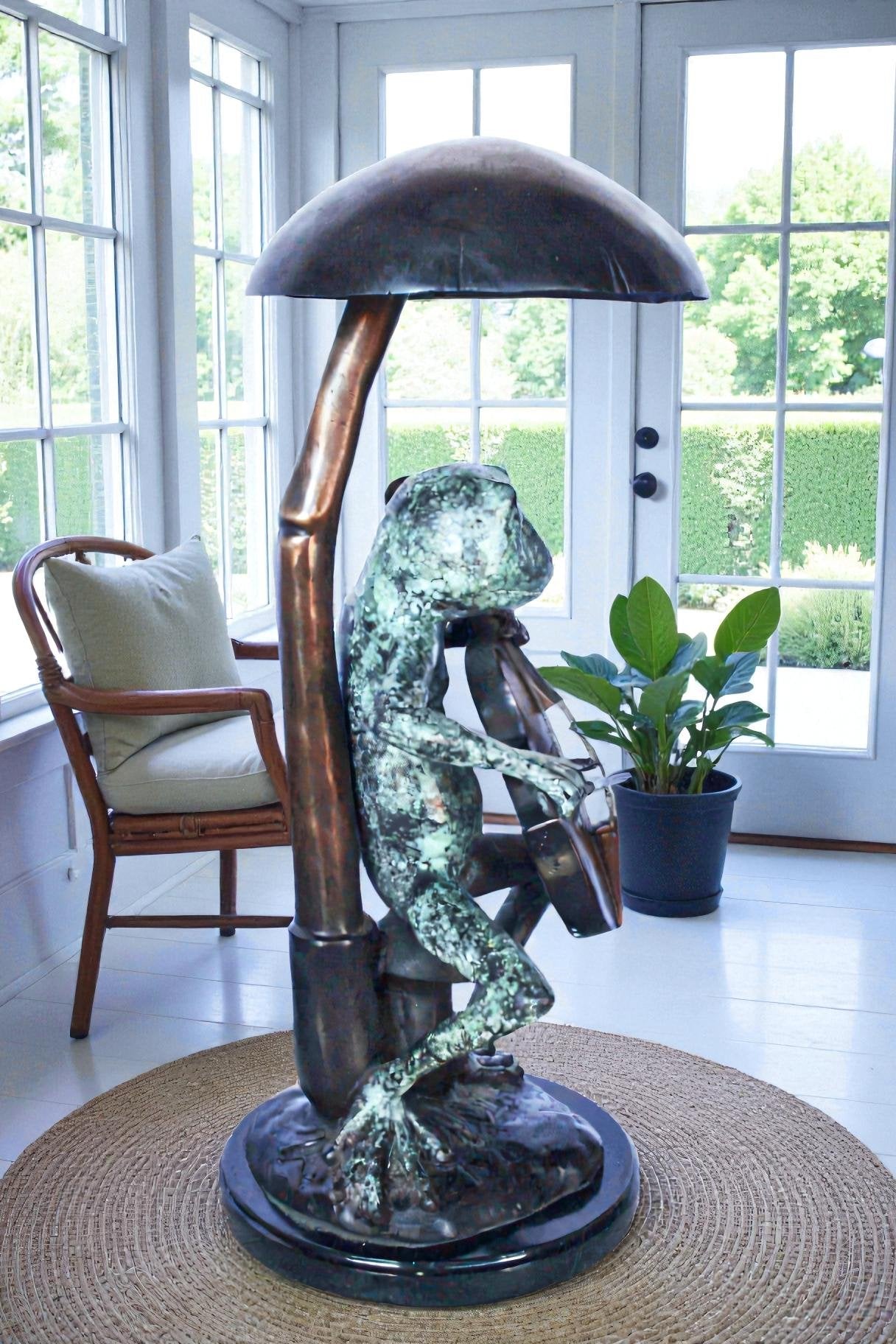Frog playing cello under mushroom bronze statue -  Size: 10"L x 10"W x 24"H.