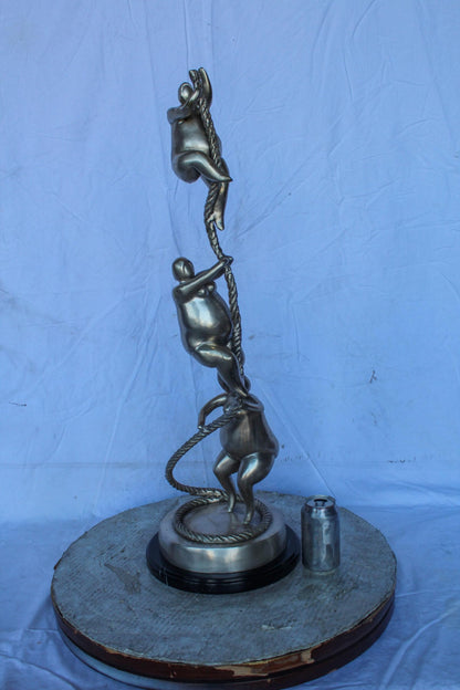 Three Voluptuous Women Climbing a Rope Statue, Silver Finish 12" x 12" x 32"H