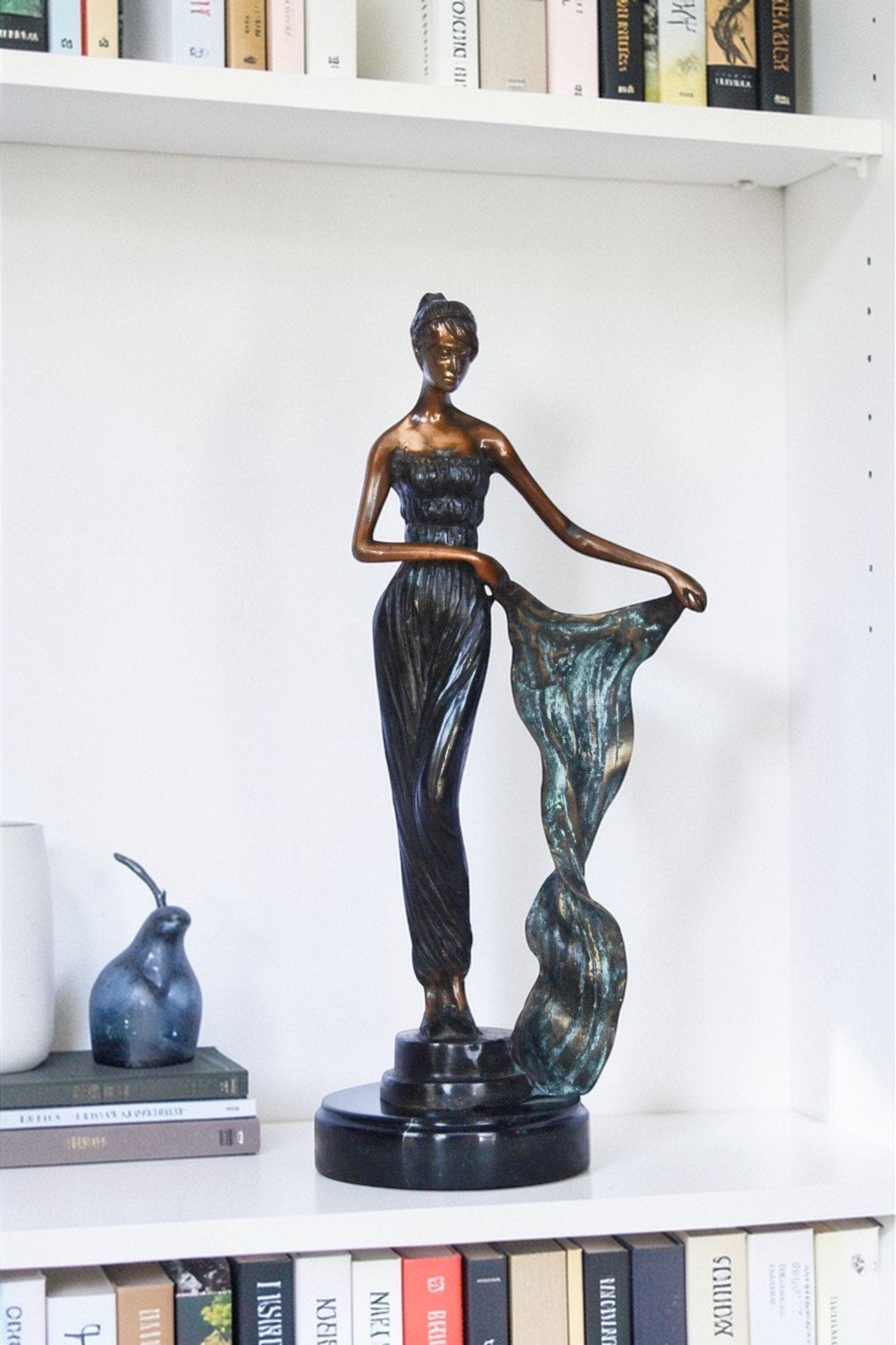 Young girl holding a sheer sheet in the wind -  Size: 6"L x 4"W x 13"H.