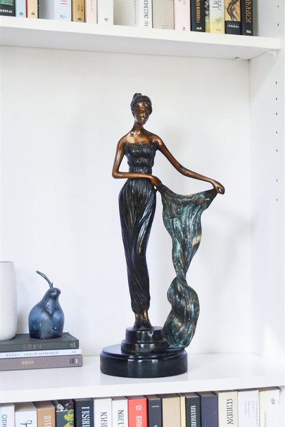 Young girl holding a sheer sheet in the wind -  Size: 6"L x 4"W x 13"H.