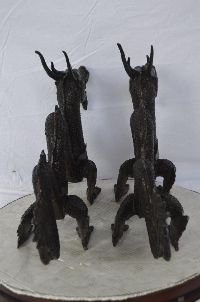 Pair of Dragons sitting side by side bronze statues -  Size: 31"L x 7"W x 16"H.