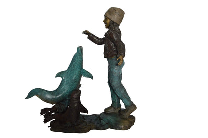 Girl feeding a dolphin and seals bronze fountain -  Size: 28"L x 17"W x 37"H.