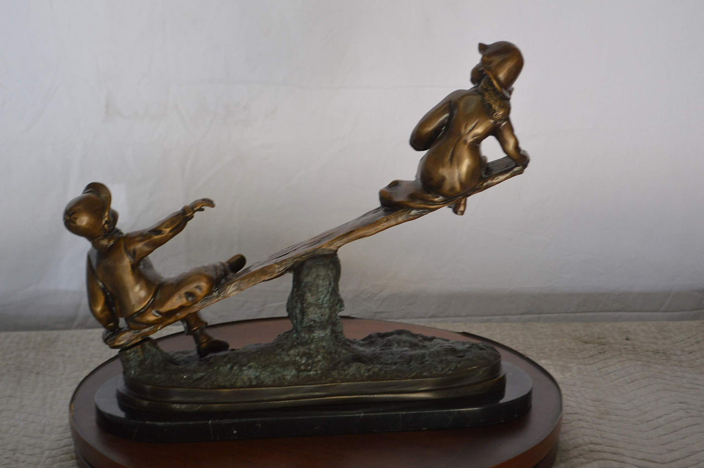 Boys Playing Seesaw on a Marble Base Bronze Statue -  Size: 22"L x 8"W x 17"H.