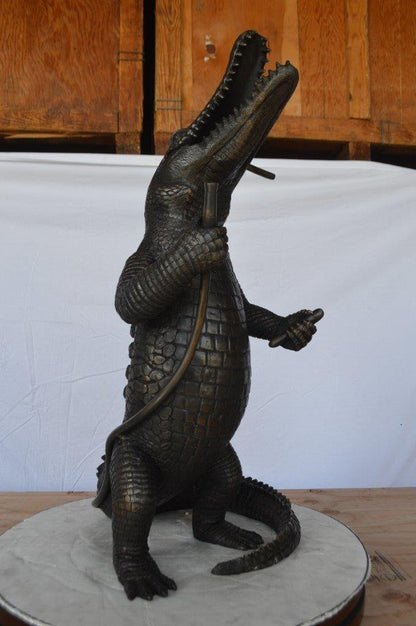 Alligator having fun bronze statue - fountain -  Size: 15"L x 15"W x 31"H.
