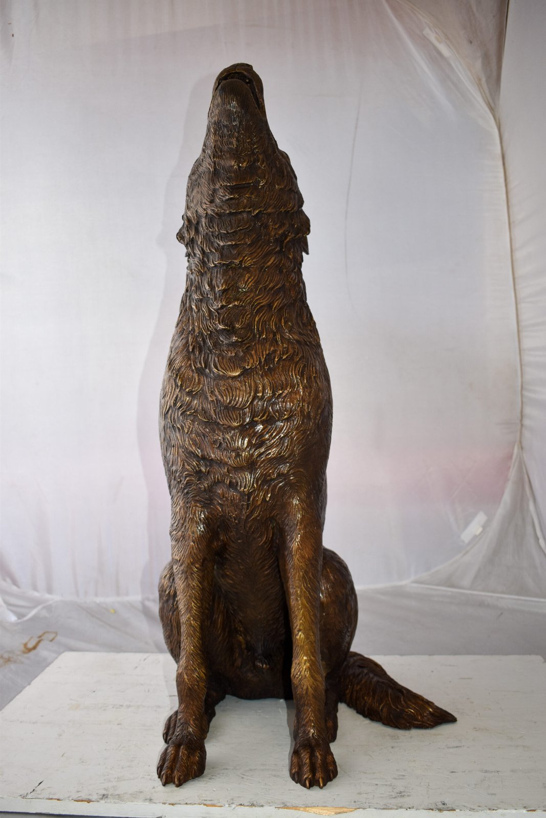 Howling Wolf looking toward the sky Bronze Statue Size: 19" x 19" x 37"H