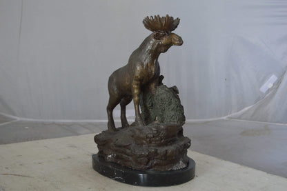 Moose on a rock bronze statue - Size: 9"L x 7"W x 14"H.