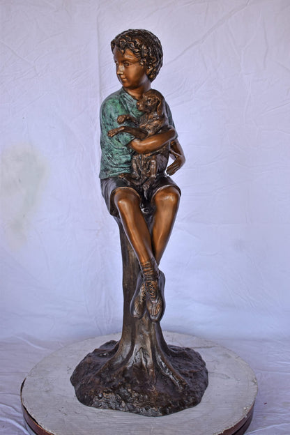 Boy Sitting on A Log with His Puppy Bronze Statue - Size: 15"L x 15"W x 35"H.