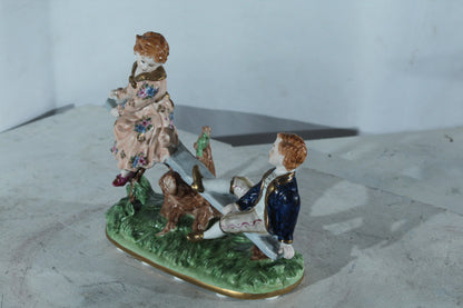 NIFAO Porcelain boy and Girl on Seesaw Figurine Vintage Style 10"x4"x9"H