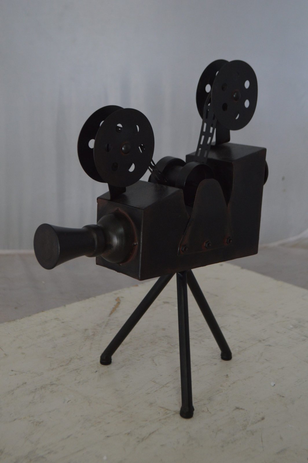Movie Reel Abstract Metal Statue on tripod -  Size: 12"L x 6"W x 15"H.