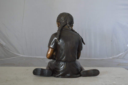 Young seated girl with bird bronze statue - Size: 12"L x 9"W x 14"H.