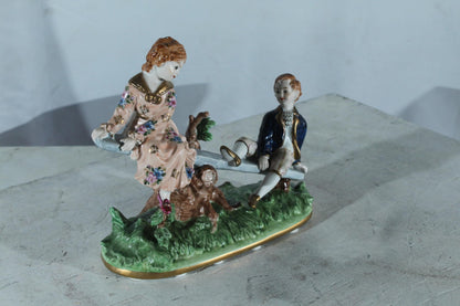 NIFAO Porcelain boy and Girl on Seesaw Figurine Vintage Style 10"x4"x9"H