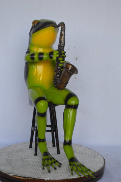 Green frog playing saxophone bronze statue - Size: 23"L x 15"W x 30"H.