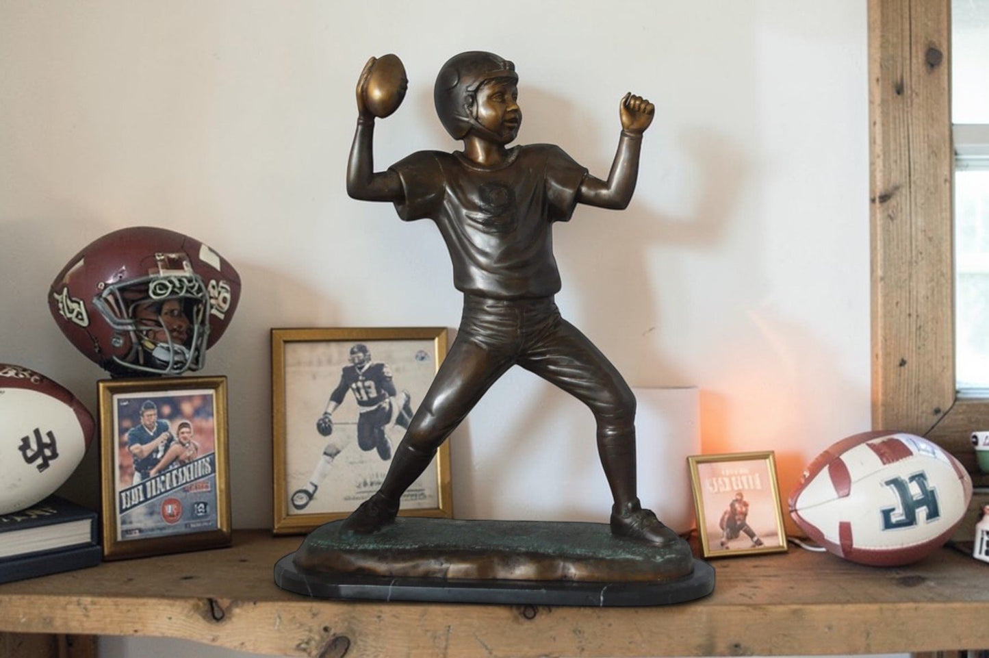 Young Quarterback bronze statue - Size: 14"L x 6"W x 20"H.