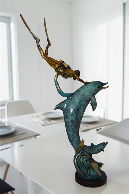 Diver With Dolphin Bronze Statue -  Size: 10"L x 30"W x 49"H.