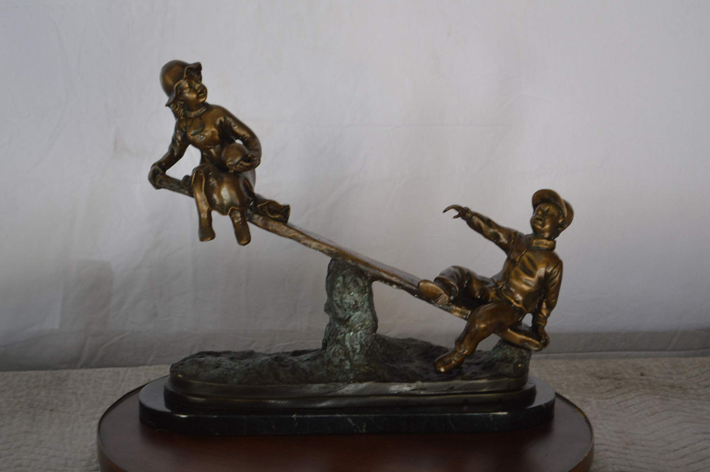 Boys Playing Seesaw on a Marble Base Bronze Statue -  Size: 22"L x 8"W x 17"H.