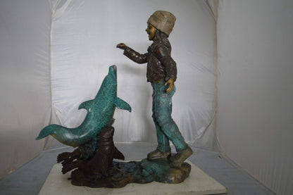 Girl feeding a dolphin and seals bronze fountain -  Size: 28"L x 17"W x 37"H.