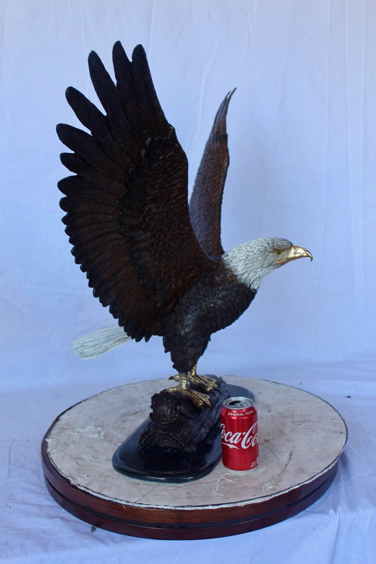 Perched eagle bronze statue -  Size: 35"L x 21"W x 29"H.