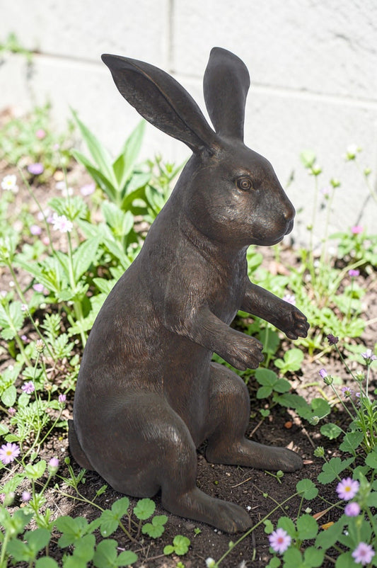 Rabbit looking down bronze statue - Size: 10"L x 12"W x 20"H.