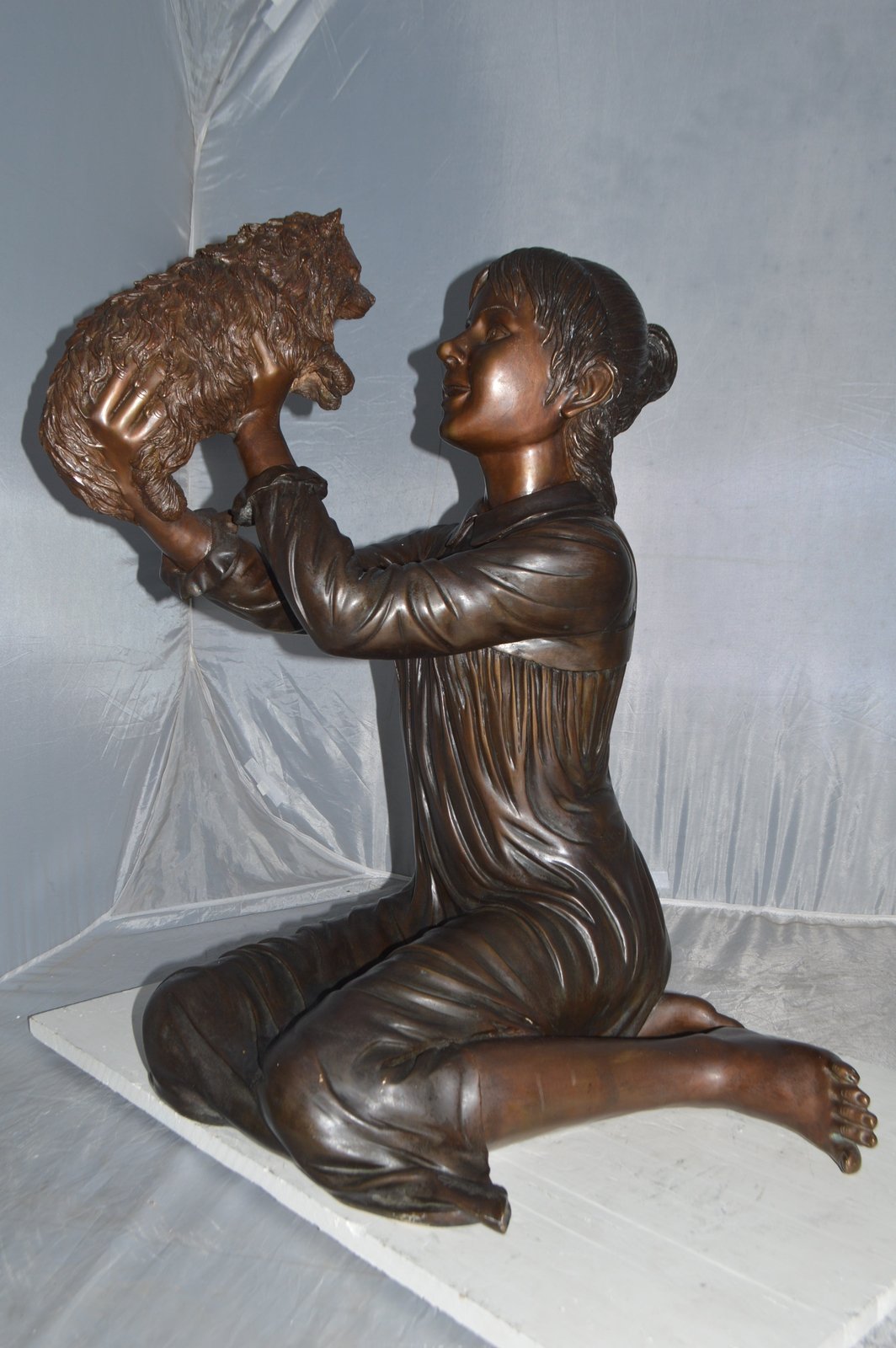 Girl Playing With Her Little Dog Bronze Statue -  Size: 22"L x 22"W x 30"H.