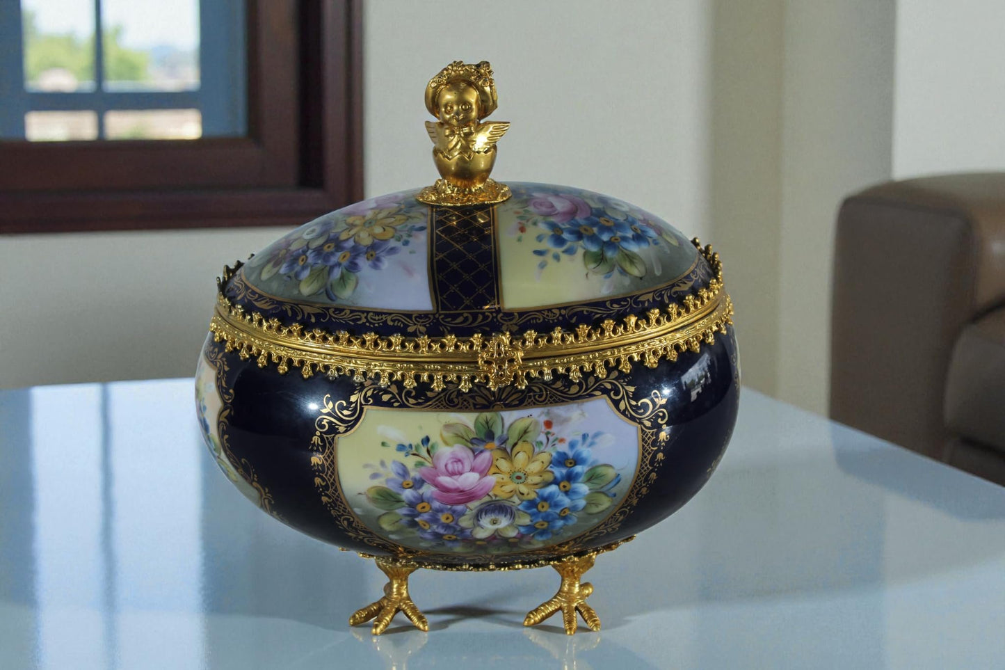 NIFAO Porcelain floral egg shaped lidded box with cherub and chicken feet 11"x8"x12"H