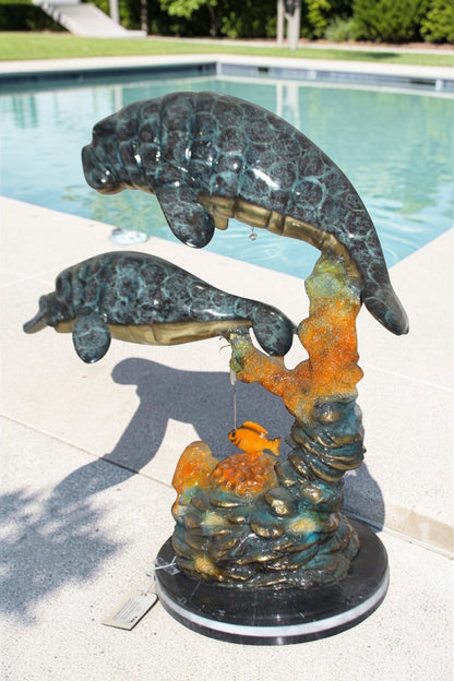 Manatees swimming - large Bronze Statue -  Size: 18"L x 28"W x 38"H.