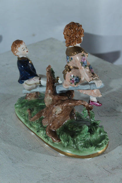 NIFAO Porcelain boy and Girl on Seesaw Figurine Vintage Style 10"x4"x9"H