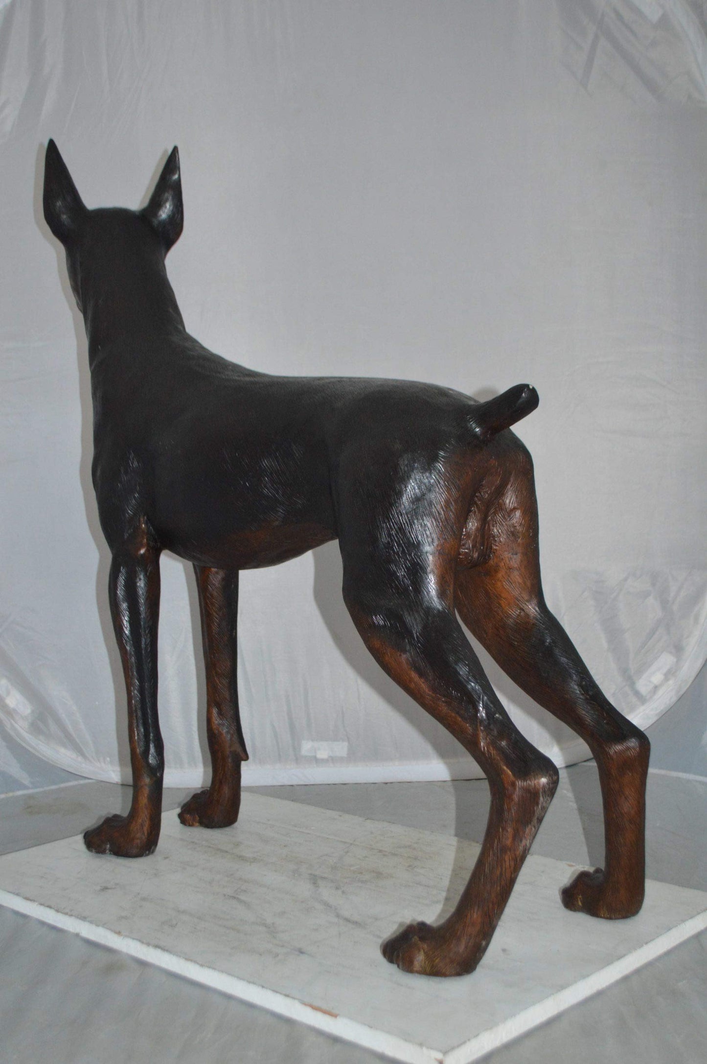 Doberman Dog Bronze Statue -  Size: 36"L x 9"W x 38"H.