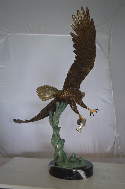 Eagle Flying With His Pray Bronze Statue -  Size: 32"L x 15"W x 33"H.