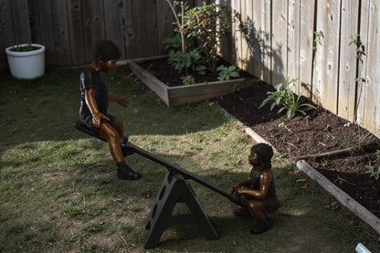 Playful Children on a See-Saw Bronze Statue Size: 76" x 27" x 59"H