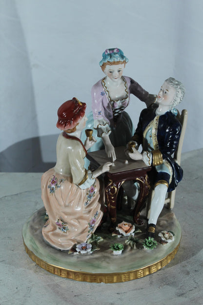 NIFAO Porcelain Figurine Group at Table with Cups 10"x10"x13"H