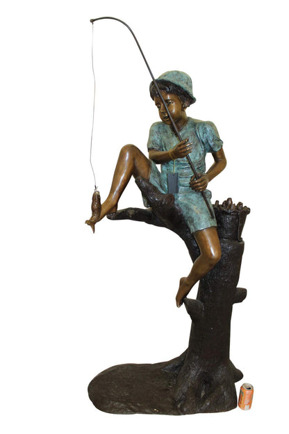 Boy Sitting on a Tree and Fishing Bronze Statue -  Size: 34"L x 28"W x 64"H.