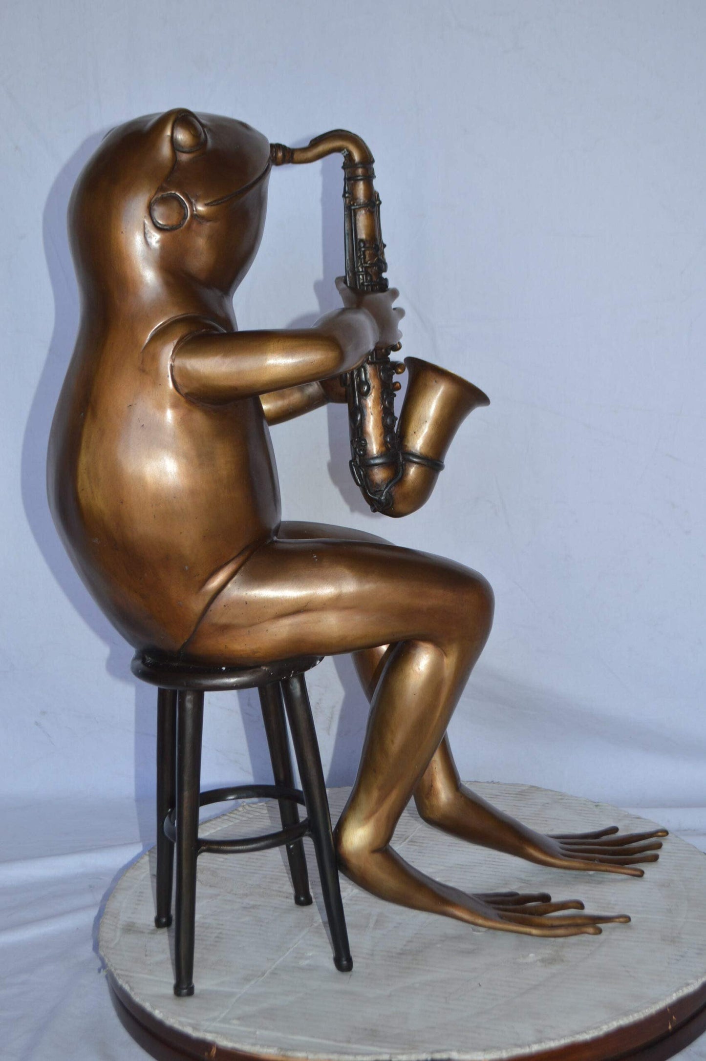 Frog playing saxophone bronze statue - Size: 23"L x 15"W x 30"H.