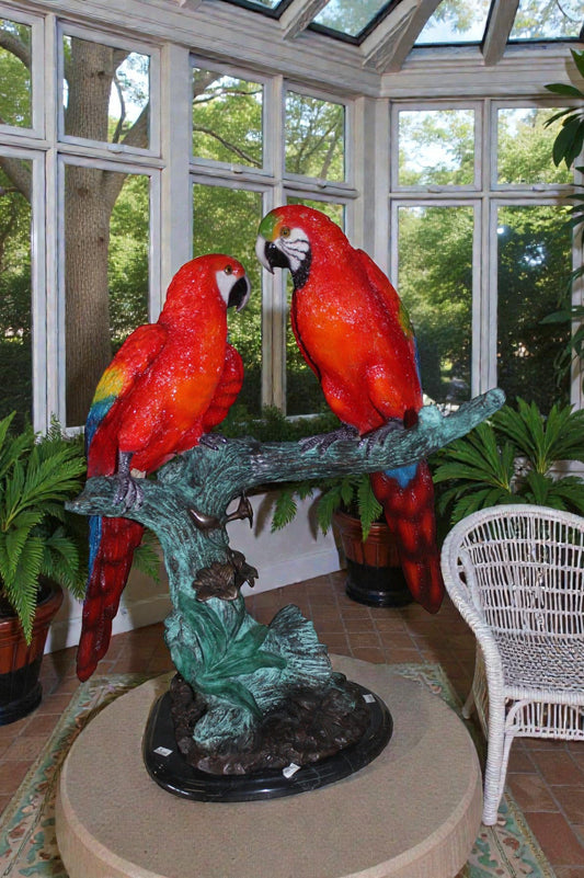 Two Bronze Beautiful Parrots On A Tree