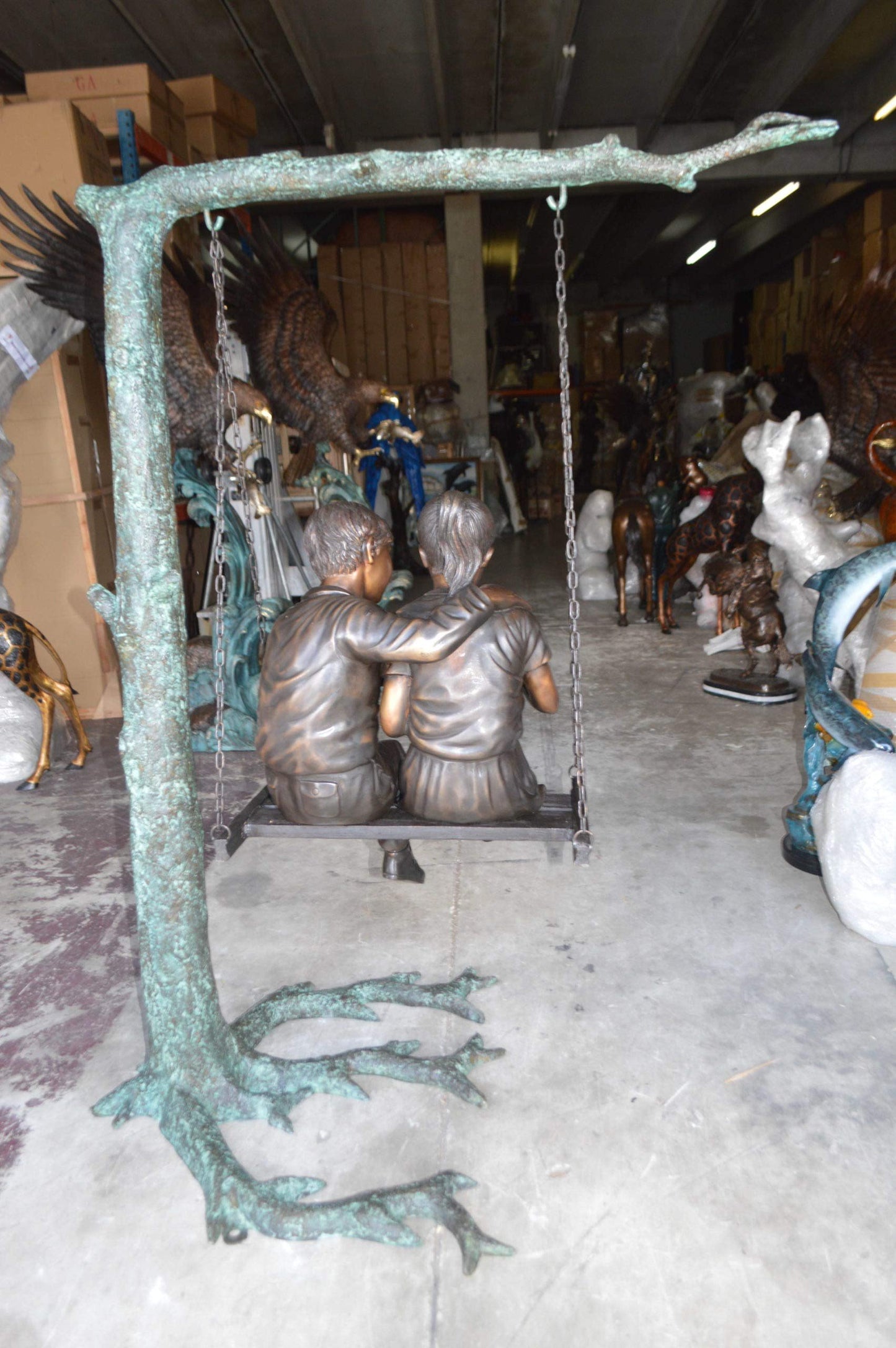NIFAO Kids on Swing Set Reading a Book Bronze Statue – Rhian Handcrafted Sculpture with Joyful Detail for Gardens, Lawns, or Playful Outdoor Spaces – 50" L x 40" W x 70" H