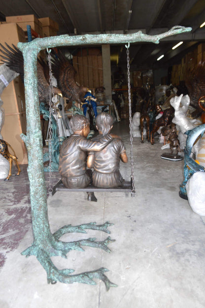 NIFAO Kids on Swing Set Reading a Book Bronze Statue – Rhian Handcrafted Sculpture with Joyful Detail for Gardens, Lawns, or Playful Outdoor Spaces – 50" L x 40" W x 70" H