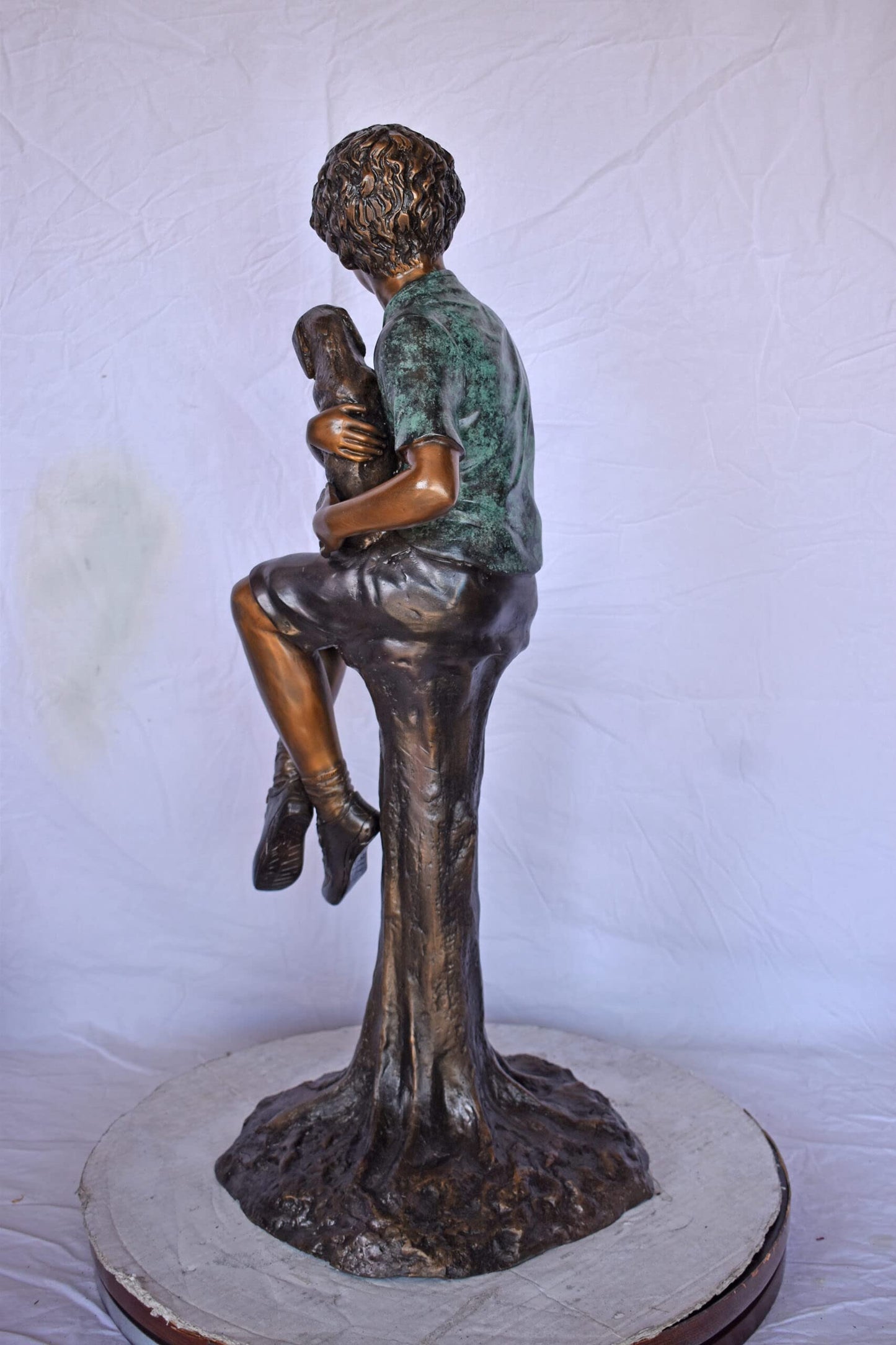 Boy Sitting on A Log with His Puppy Bronze Statue - Size: 15"L x 15"W x 35"H.