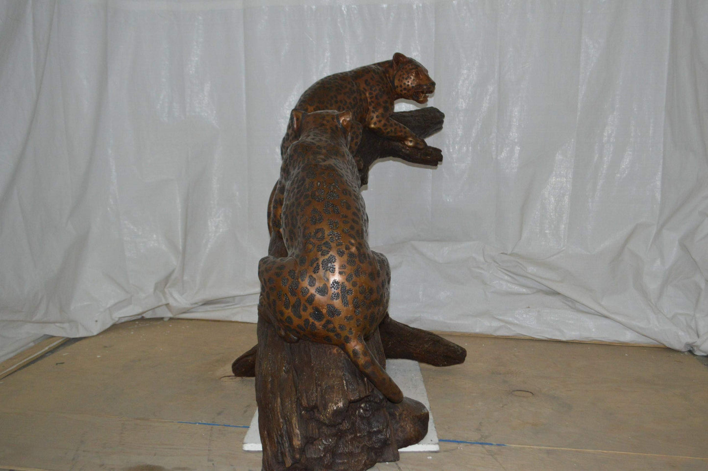 Two Jaguars On A Tree Bronze Statue - Size: 66"L x 34"W x 44"H.