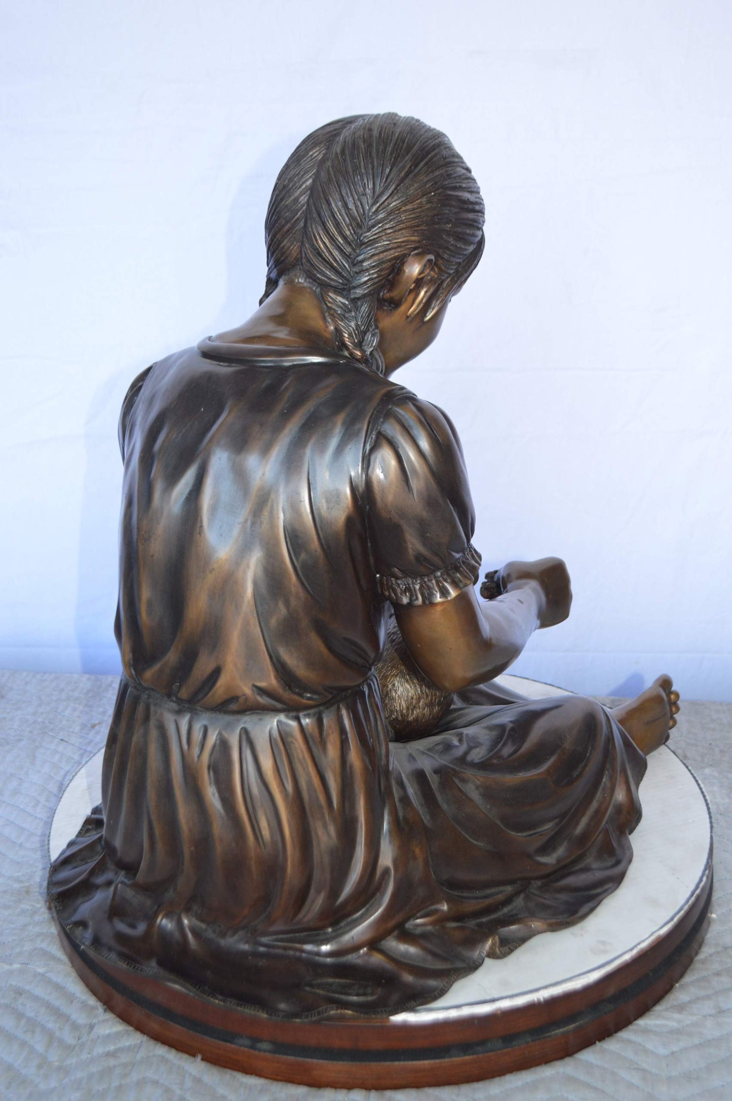 Sandra Sitting With Her Rabbit Bronze Statue -  Size: 25"L x 18"W x 25"H.