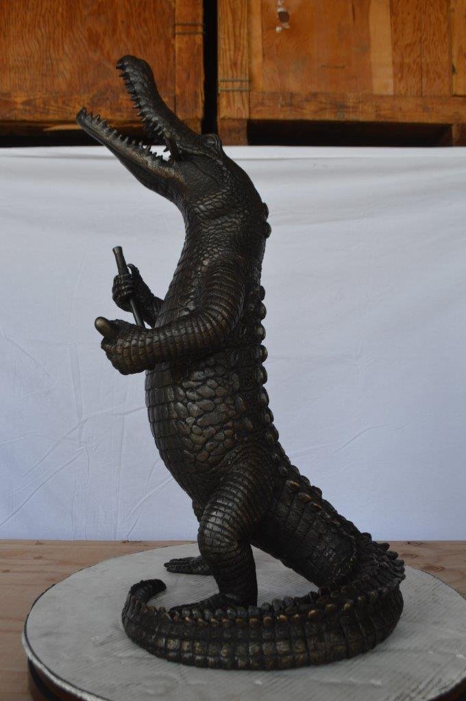 Alligator having fun bronze statue - fountain -  Size: 15"L x 15"W x 31"H.