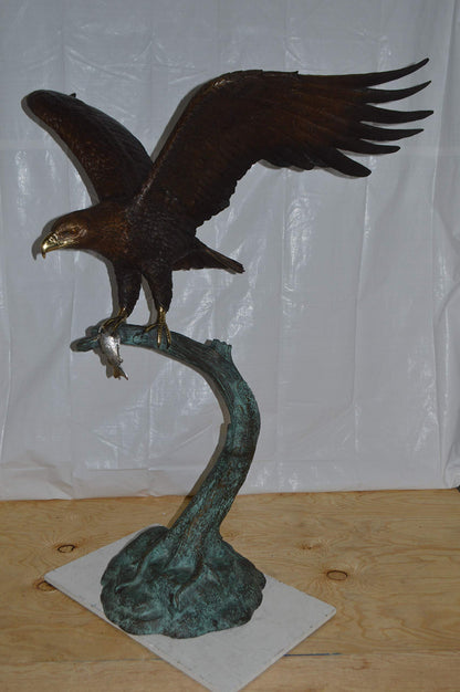 Eagle on a Tree Branch Bronze Statue -  Size: 44"L x 50"W x 65"H.