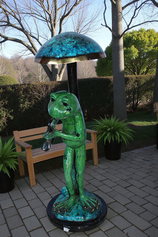 Jazzy frog perched under mushroom bronze statue   -  Size: 10"L x 10"W x 28"H.
