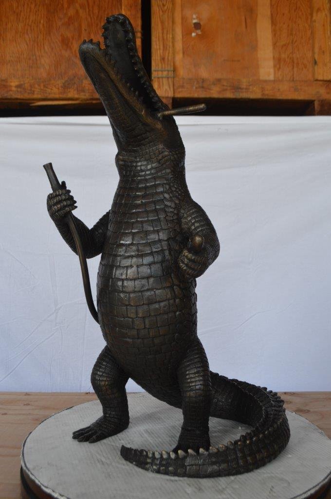 Alligator having fun bronze statue - fountain -  Size: 15"L x 15"W x 31"H.
